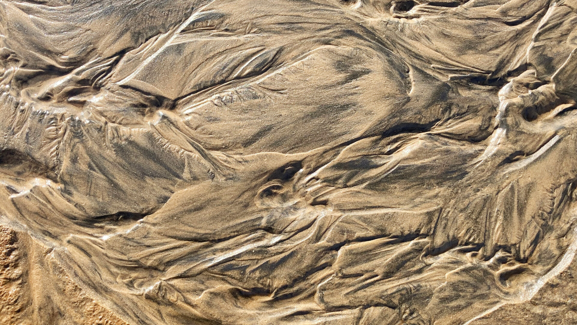 meriveden muovaamaa hiekkaa